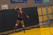 Pahrump Valley’s Xe’ane Kamanu prepares to serve during the Trojans’ three-set victory at ...