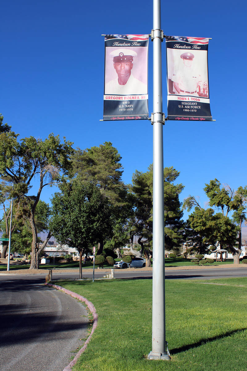 Banners honoring Nye County veterans hang from the light poles that run along Calvada Blvd. and ...