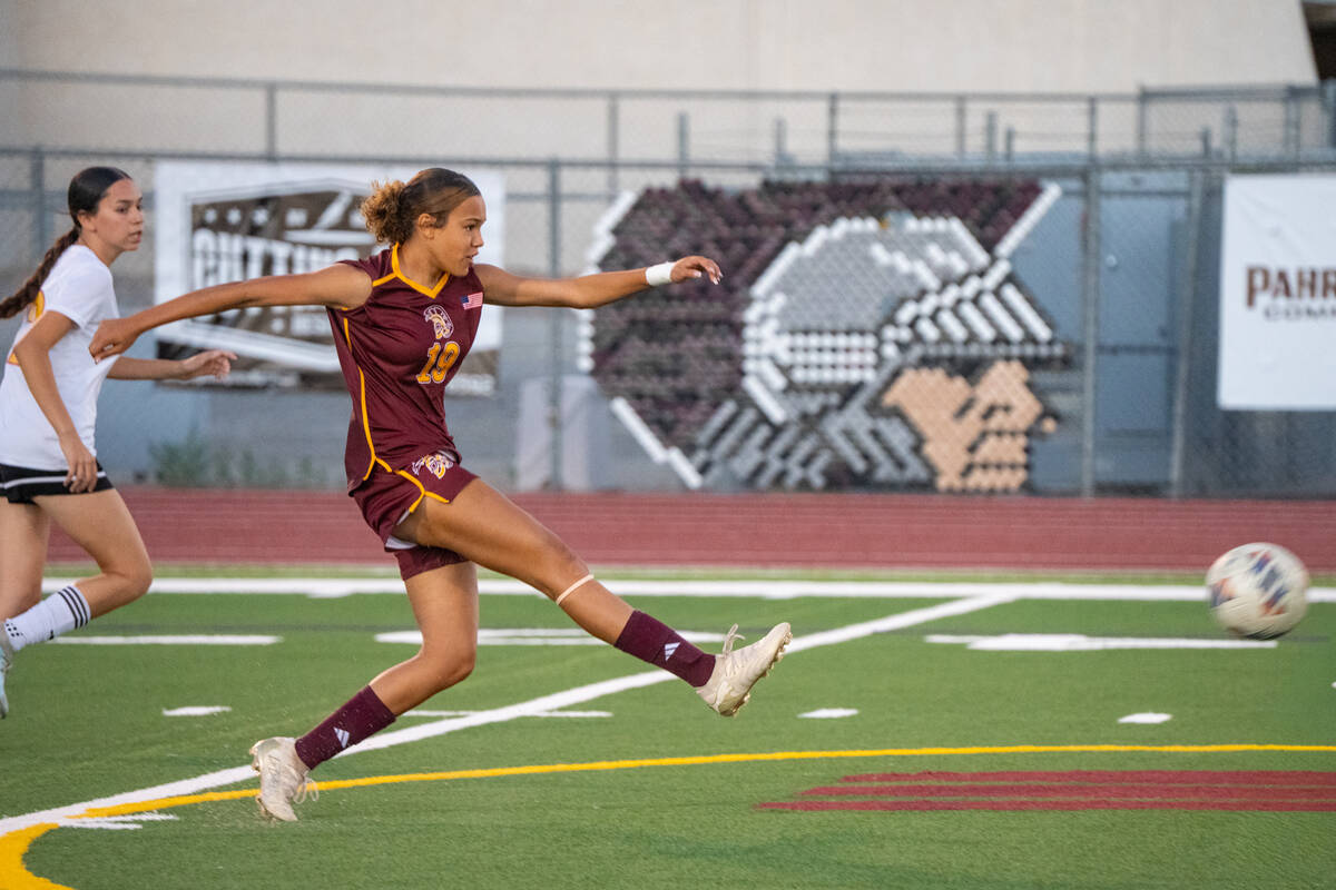 Pahrump Valley’s Josie Gaitan (19) kicks the ball during play against Somerset Academy Losee ...