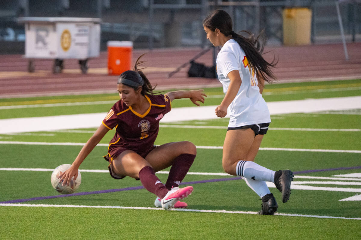 Pahrump Valley’s Melissa Nunez-Ramirez (5) goes to the turf with a Somerset Academy Losee pla ...