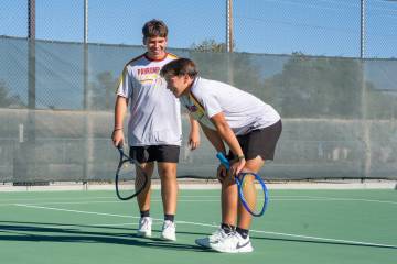 Tristan Torres, left, and his younger brother Brendan share a smile on the court during Pahrump ...