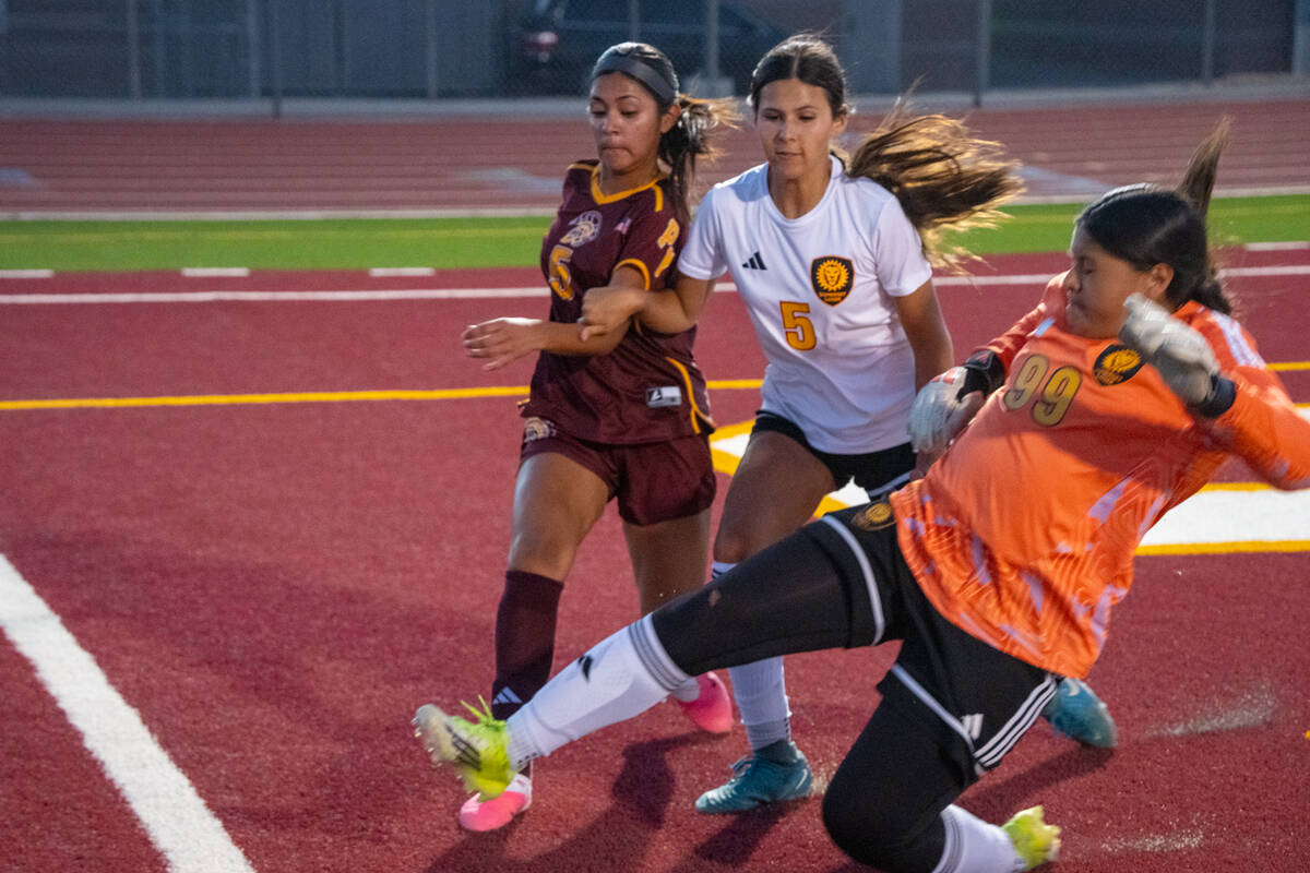 Pahrump Valley’s Melissa Nunez-Ramirez (5) battles for position near the goal as Somerset Aca ...