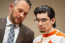 Attorney Michael A. Troiano (left) speaks with his client, Carlos Blakely (right) in Fifth Judi ...