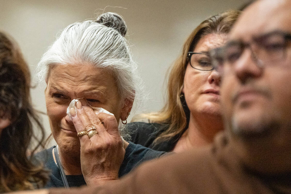 Joey Perry's mother, Mari Ausiello, watches Anthony Aguilar and Carlos Blakely enter guilty ple ...