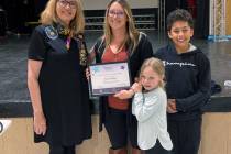 Pahrump Soroptimist Nancy Davis poses with Live Your Dream Award recipient Aimee Riley and her ...