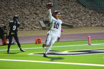 Pahrump Valley’s Lucas Gavenda celebrates a touchdown during the Trojans’ 21–14 victory a ...