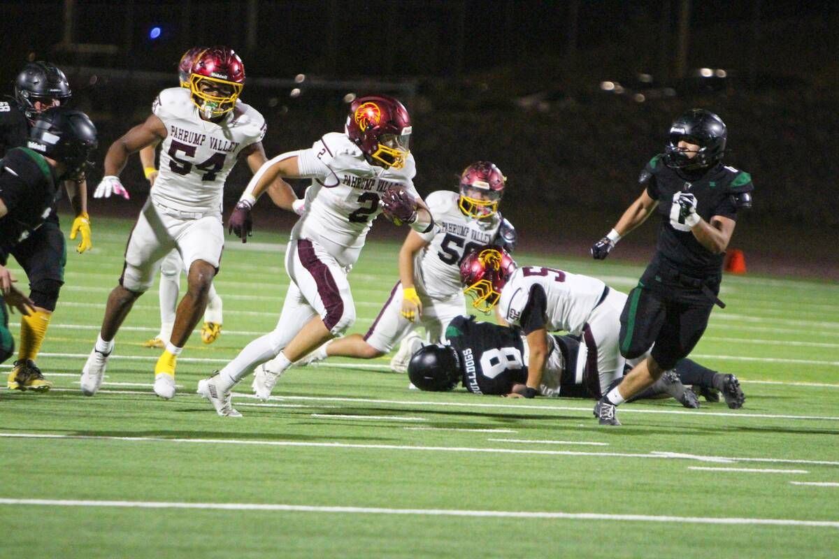 Pahrump Valley’s Preston Dockter carries the ball against Virgin Valley on Sept. 25. Dockter ...