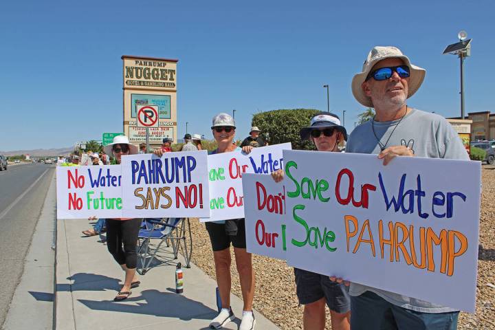 Pahrump residents line Highway 160 in front of the Pahrump Nugget on July 18 to take part in a ...