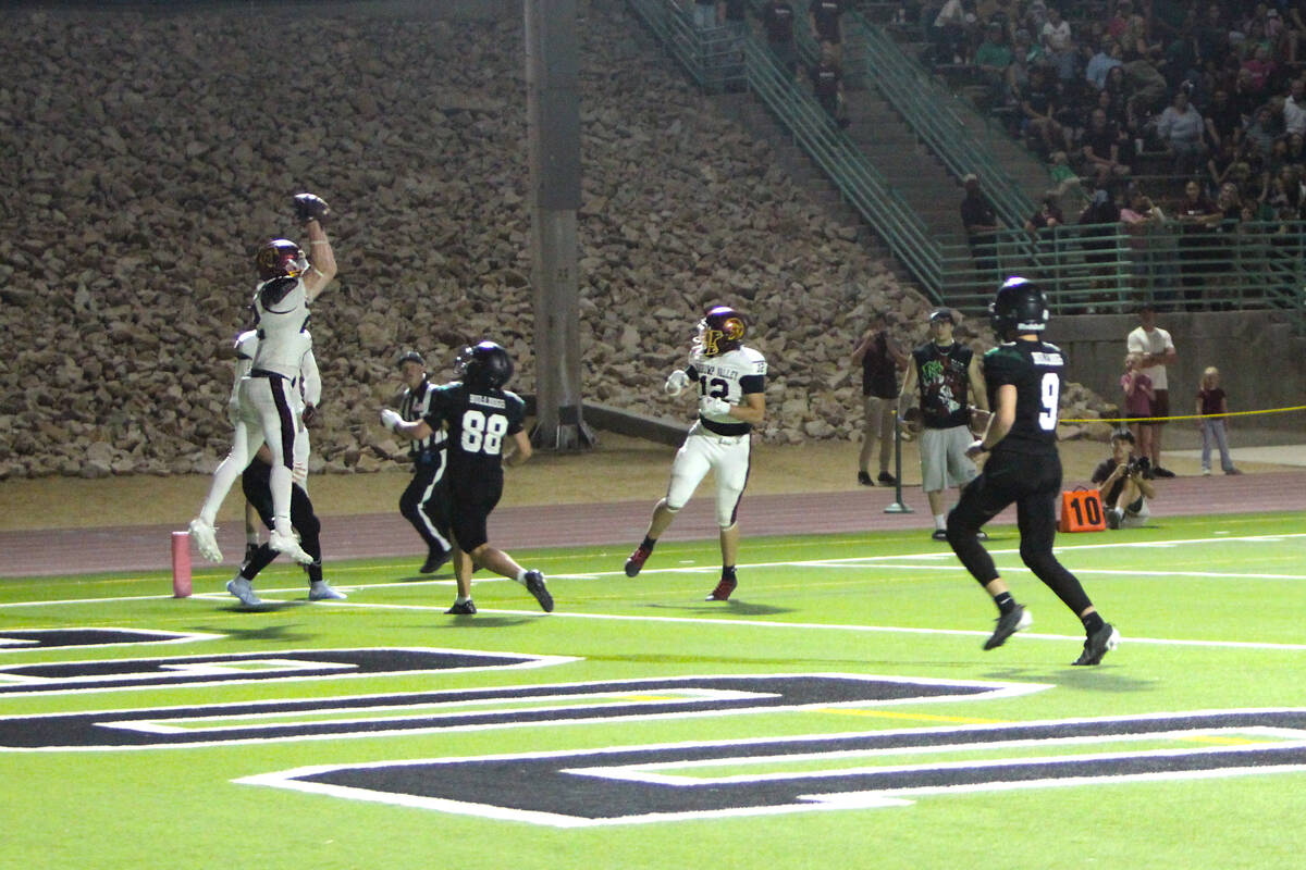 Pahrump Valley’s Paul Walker leaps for a pass in the end zone during the Trojans’ Sept. 25 ...