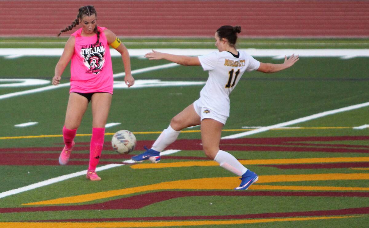 Pahrump Valley captain Sydney Crotty, left, challenges Boulder City’s Shasta Ryan-Willett (11 ...