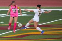Pahrump Valley captain Sydney Crotty, left, challenges Boulder City’s Shasta Ryan-Willett (11 ...