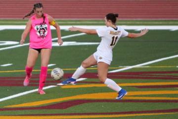 Pahrump Valley captain Sydney Crotty, left, challenges Boulder City’s Shasta Ryan-Willett (11 ...