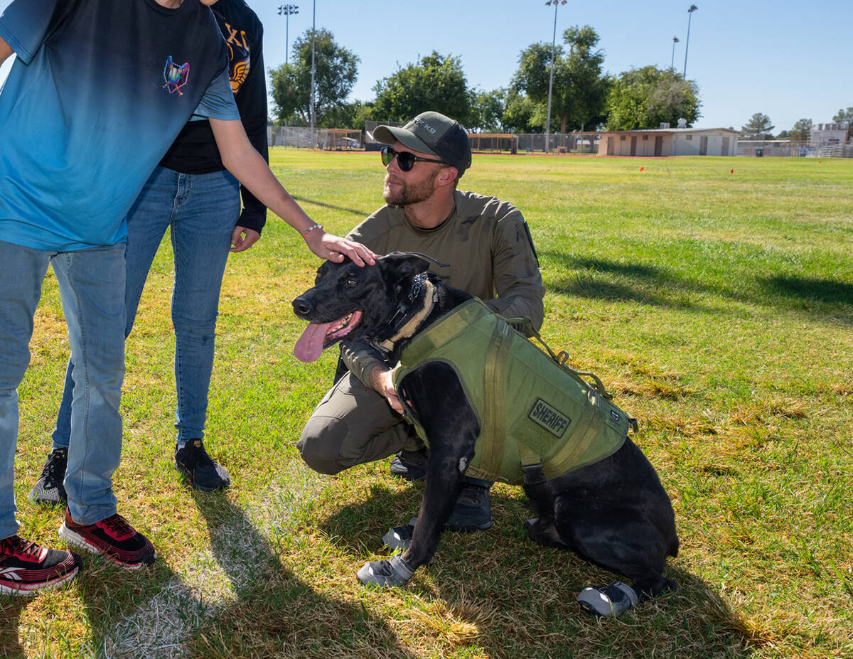 During the visit, children from the school got to pet one of the sheriff's office K-9s. (John C ...