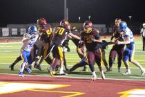 Pahrump Valley’s Preston Dockter carries the ball in the end zone during the Trojans’ homec ...