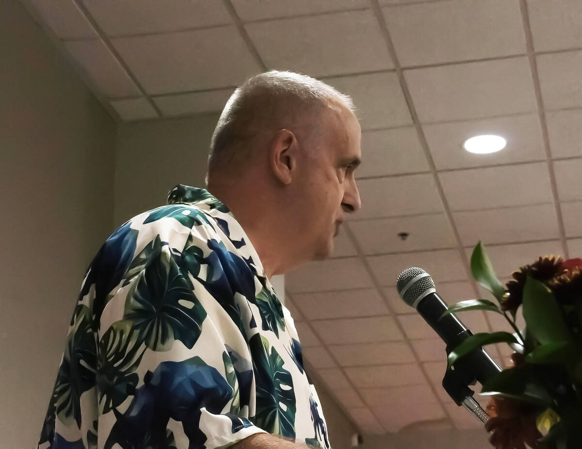 Republican District Attorney Brian Kunzi speaks in front of the audience at Saturday's dinner. ...