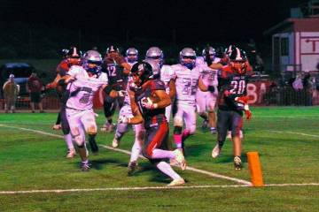 Tonopah’s Dustin Otteson (25) carries the ball into the end zone against Pahranagat Valley du ...