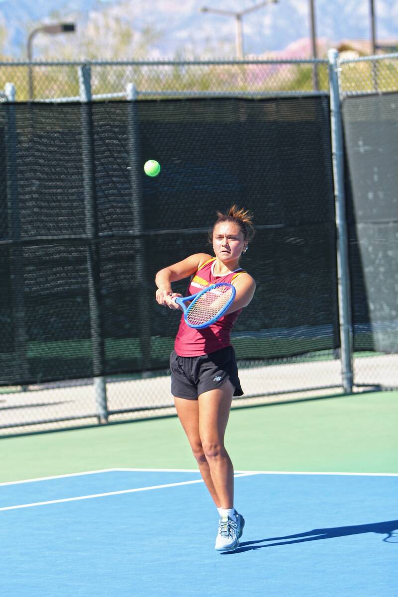 Pahrump Valley junior Aurora Bowers follows through on a backhand during the Class 3A Southern ...