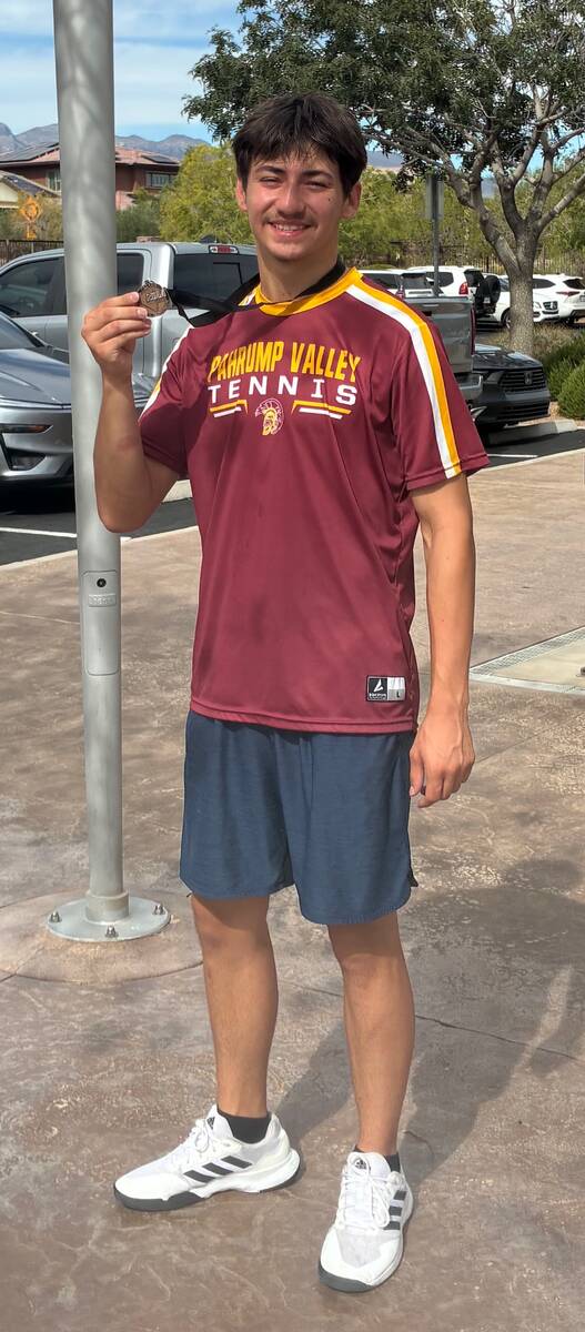 Pahrump Valley junior Jace Eichner displays his medal after finishing fourth in boys singles at ...