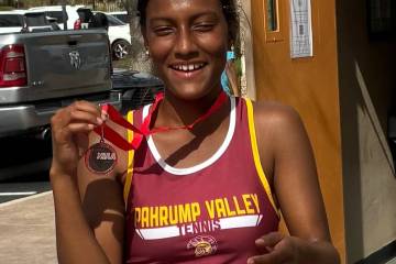 Pahrump Valley senior Chanel Anthony shows her medal after finishing second in girls singles at ...