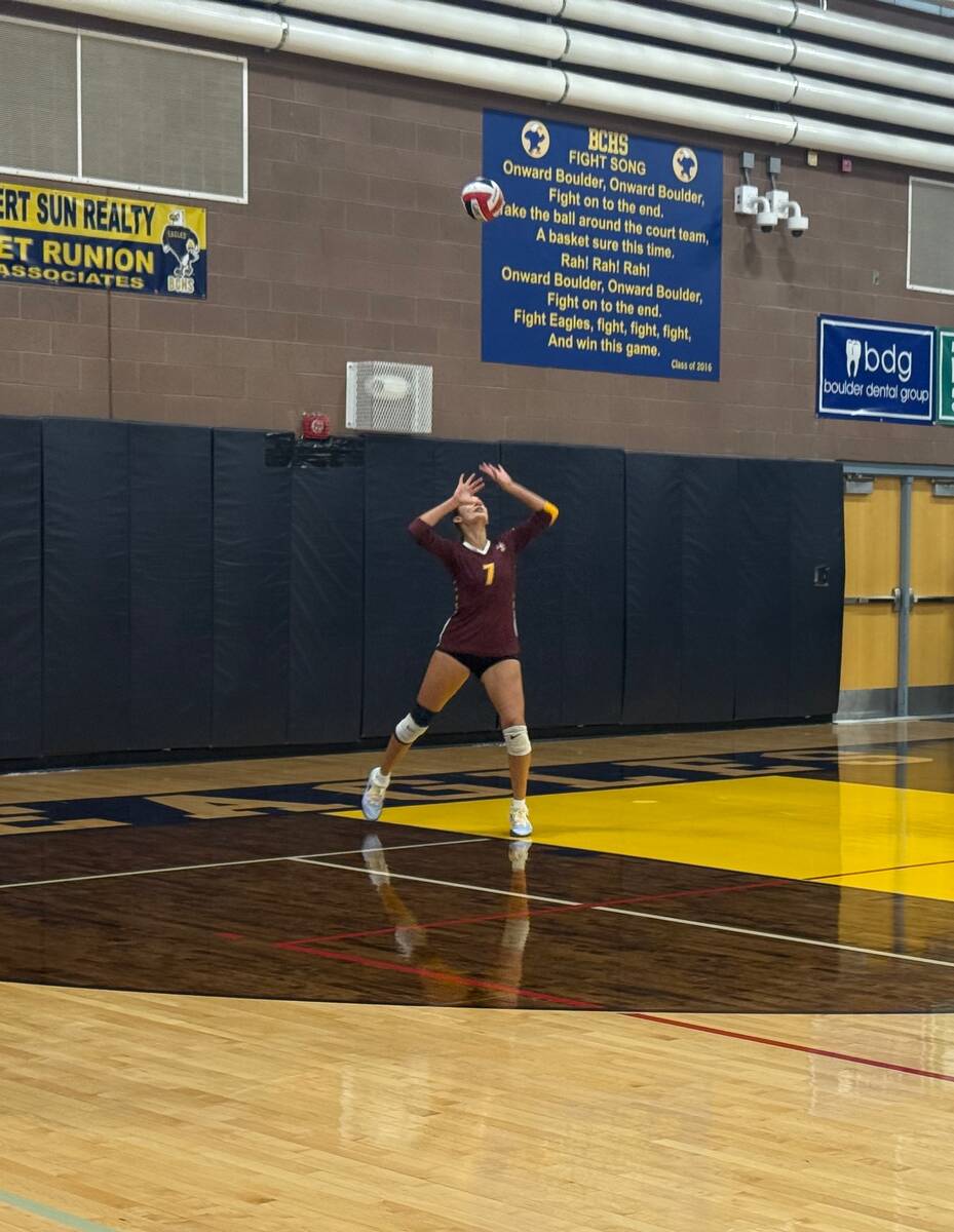 Pahrump Valley’s Riley Saldana prepares to serve during the Trojans’ Sept. 1 match at Bould ...