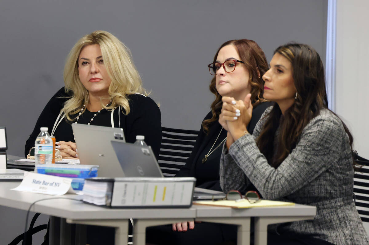 Suspended Pahrump Justice of the Peace Michele Fiore, left, and her attorneys Gia Marina and Pa ...