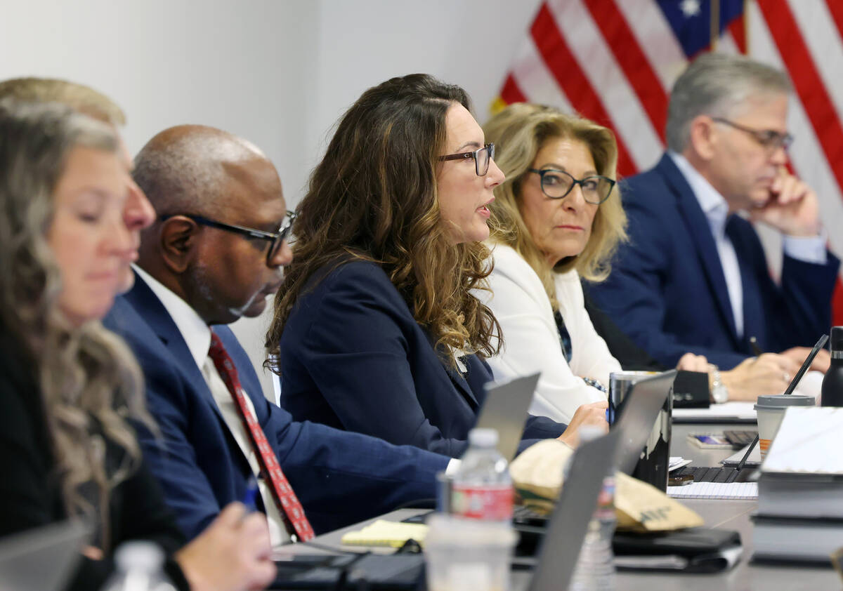 Commissioner Kendra Bertschy, center, speaks during a judicial discipline hearing for suspended ...