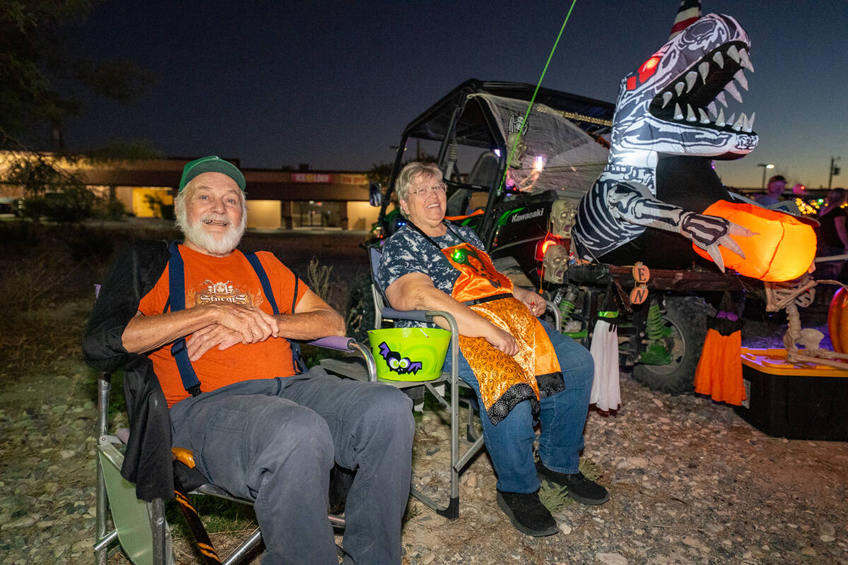 Pahrump residents Skeet Smith and Linda Wright-Smith were among those helping to hand out candy ...