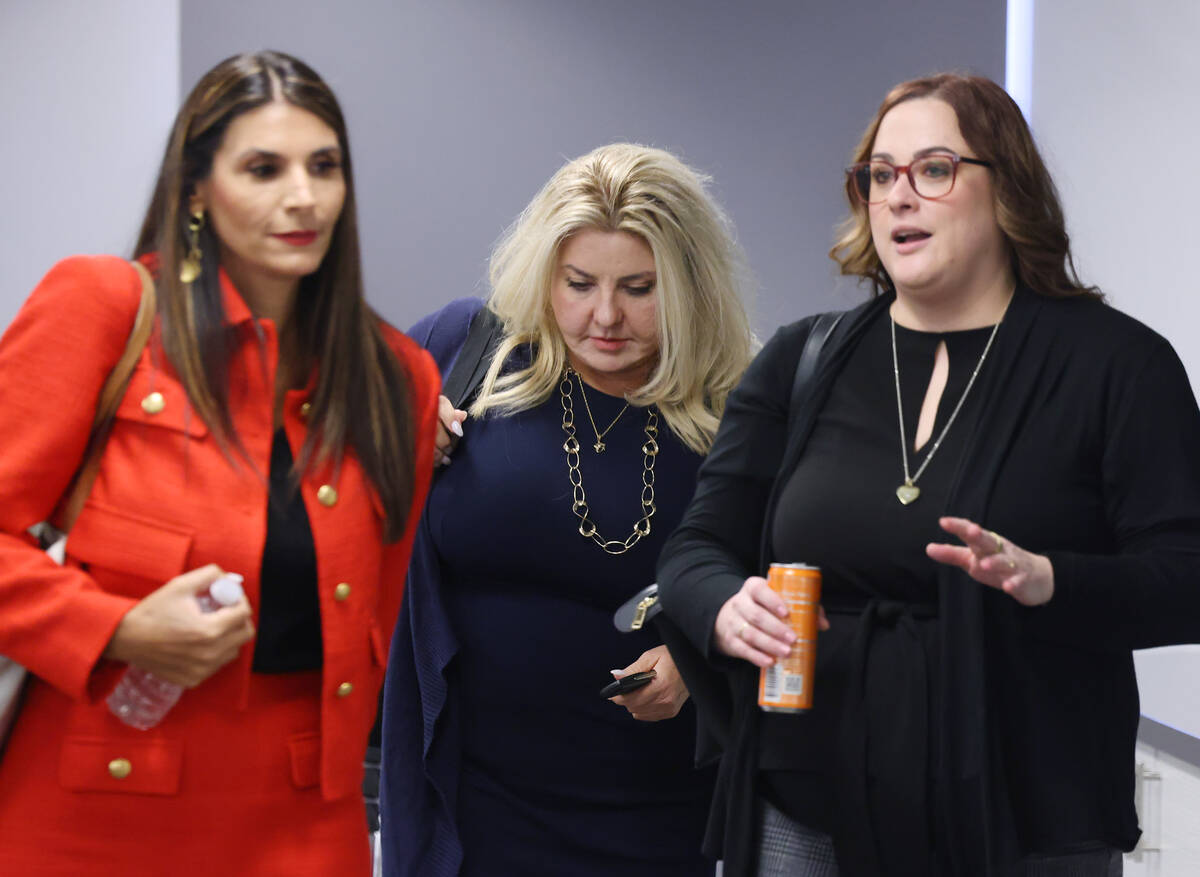 Former Las Vegas Councilwoman and suspended Pahrump Justice of the Peace Michele Fiore, center, ...