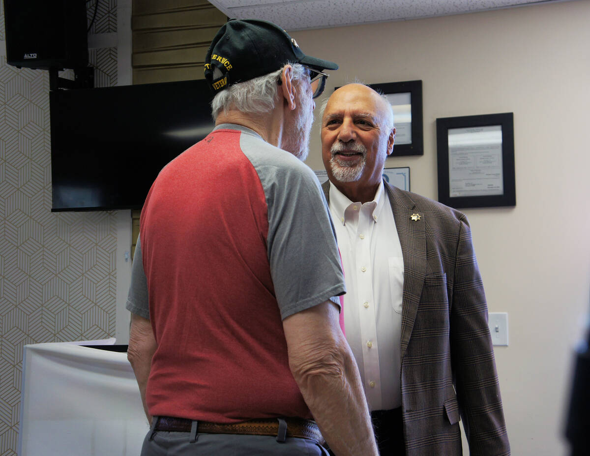 Lt. Gov. Stavros Anthony chats with an attendee before speaking at the voter voter ID rally in ...