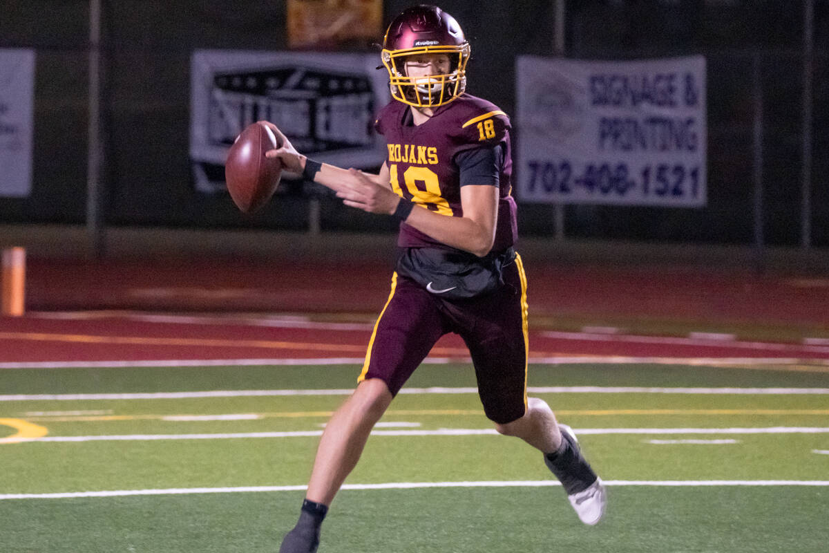 Pahrump Valley quarterback Evan Strain prepares to throw against Boulder City on Friday, Oct. 2 ...