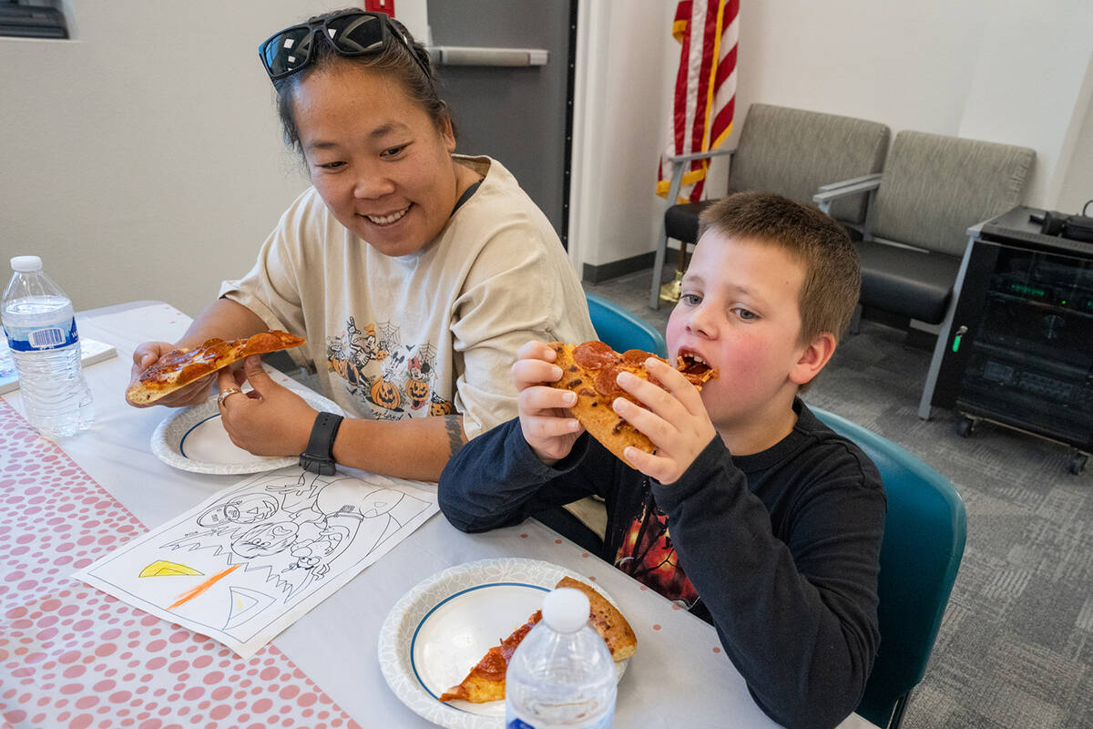 During the grant celebration, attendees ate food from the local Pahrump Pizza Hut. (John Clause ...