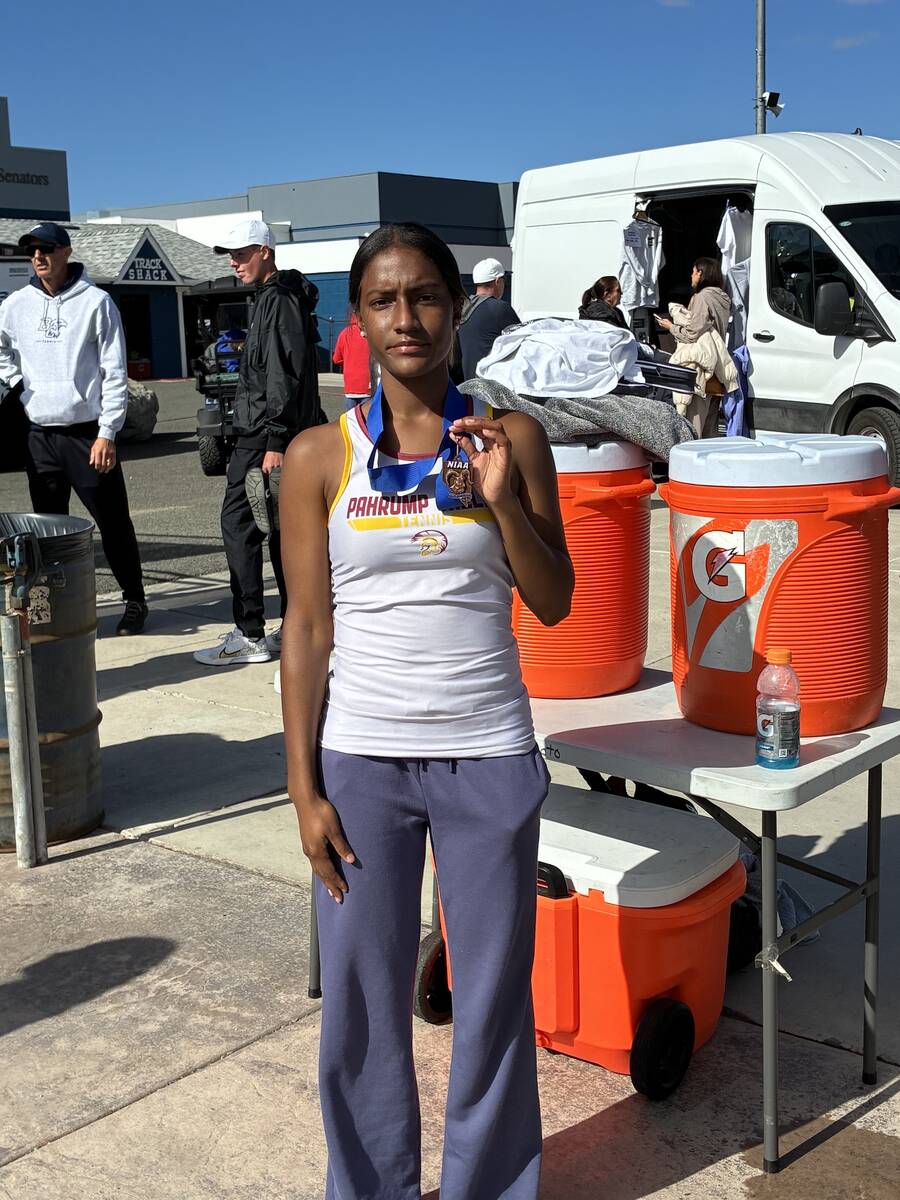 Pahrump Valley senior Chanel Anthony displays her third-place medal at the Class 3A state tenni ...