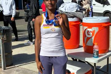 Pahrump Valley senior Chanel Anthony displays her third-place medal at the Class 3A state tenni ...