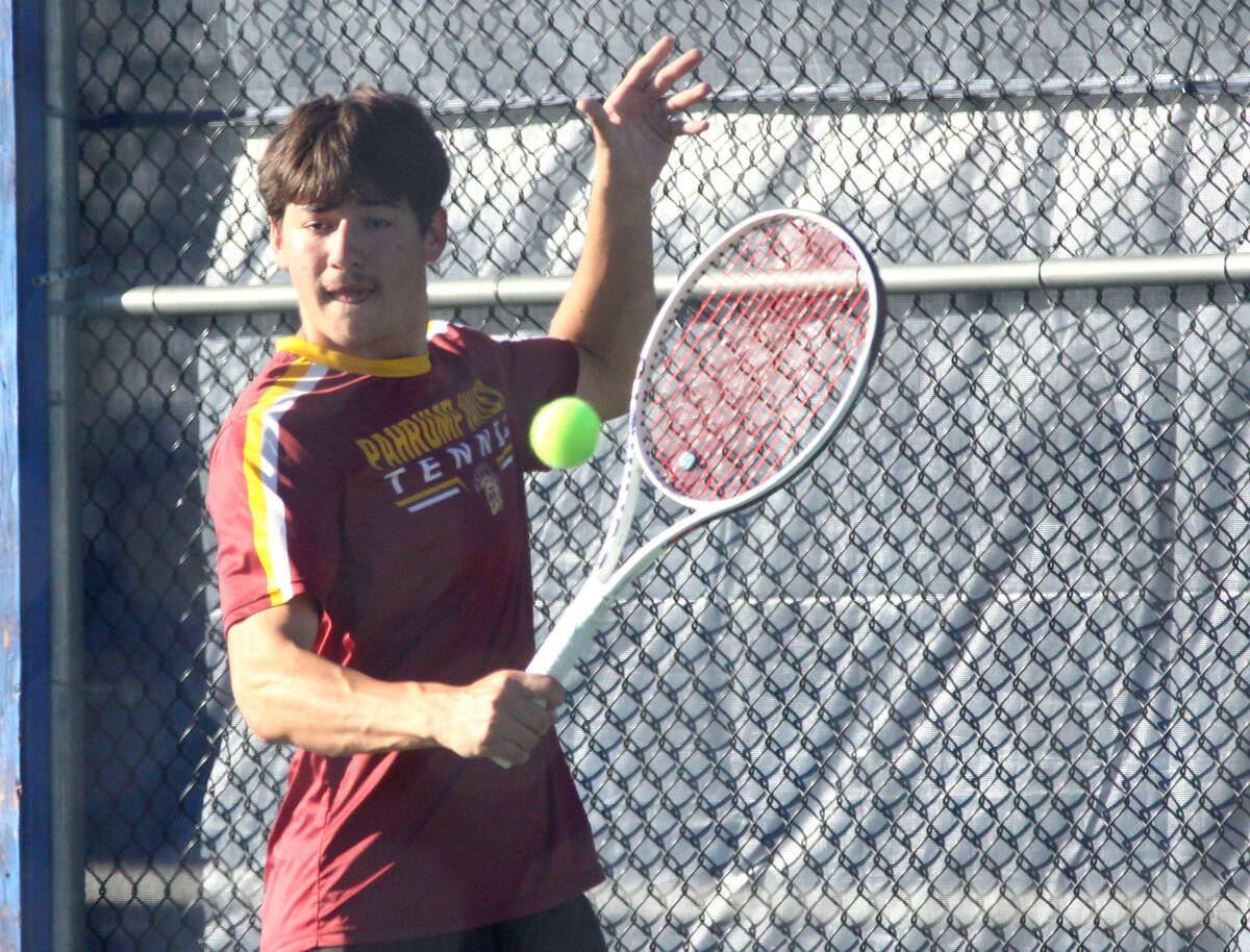 Pahrump Valley junior Jace Eichner hits a shot during his Class 3A state singles quarterfinal a ...