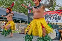 Garbed in island dress, dancers entertain the audience at a Hui Hou Festival, which will be com ...