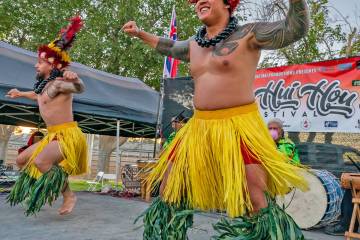 Garbed in island dress, dancers entertain the audience at a Hui Hou Festival, which will be com ...