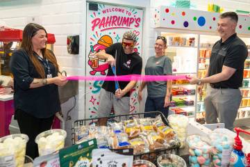 Husband and wife team Colin and Tay McCarthy, center, were delighted to host a grand opening an ...