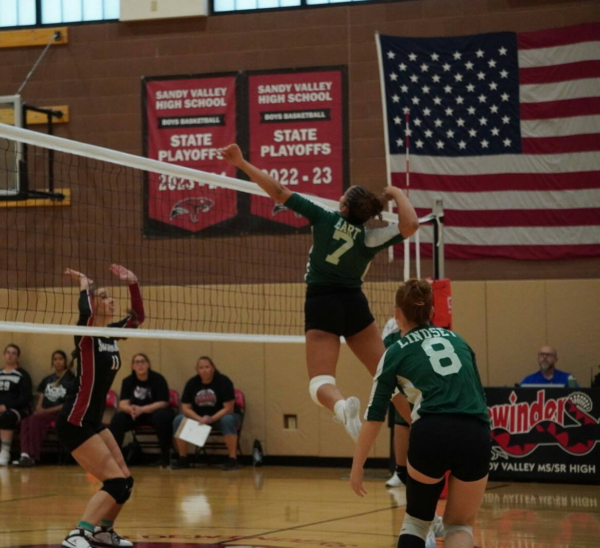 Beatty’s Lavender Hart (7) attacks at the net as teammate Julieann Lindsey (8) follows the pl ...