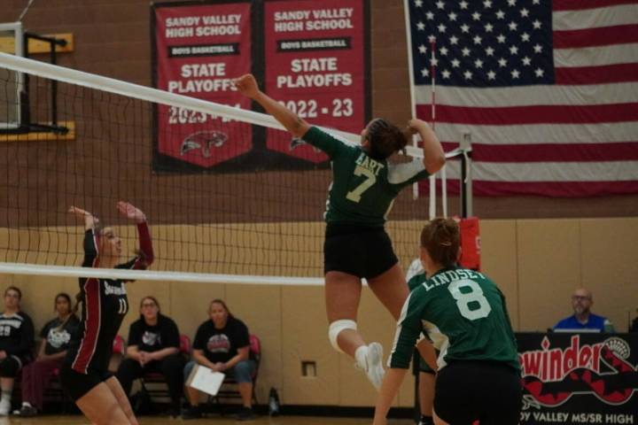 Beatty’s Lavender Hart (7) attacks at the net as teammate Julieann Lindsey (8) follows the pl ...