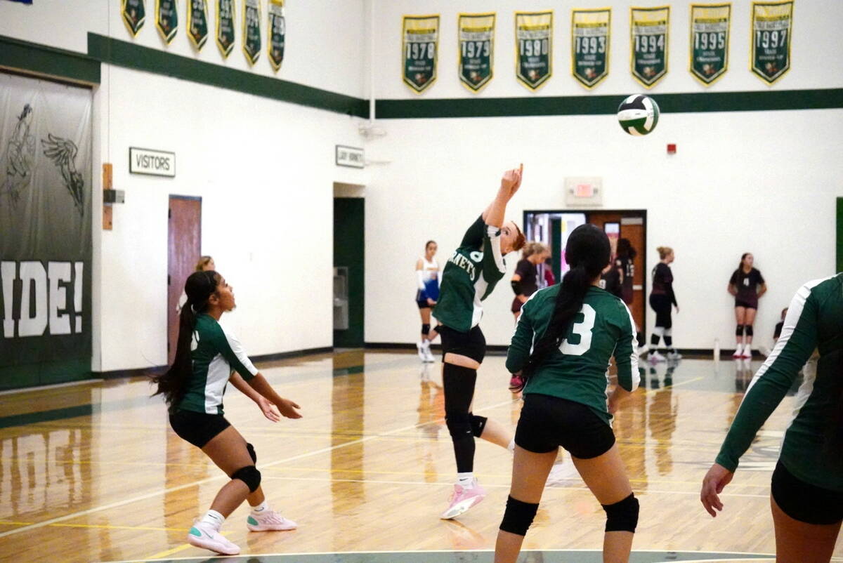 Beatty’s Julieann Lindsey (8) plays the ball as teammate Bella Villanueva (3) prepares behind ...