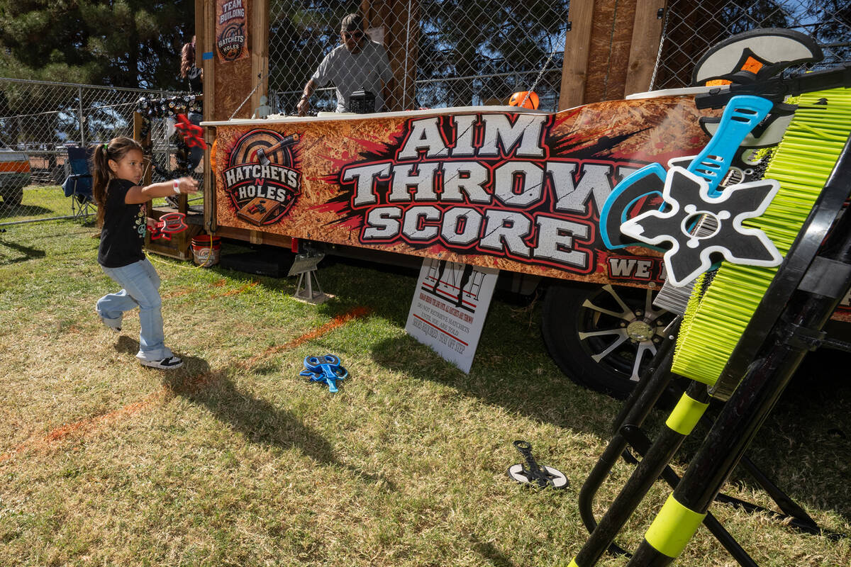 Real axe and plastic axe throwing was available at Pumpkin Days this year. (John Clausen/Pahrum ...